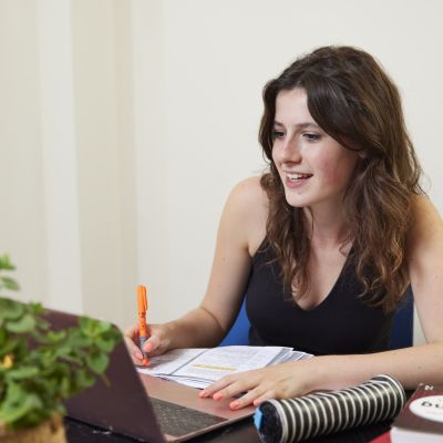 A girl sits at a desk